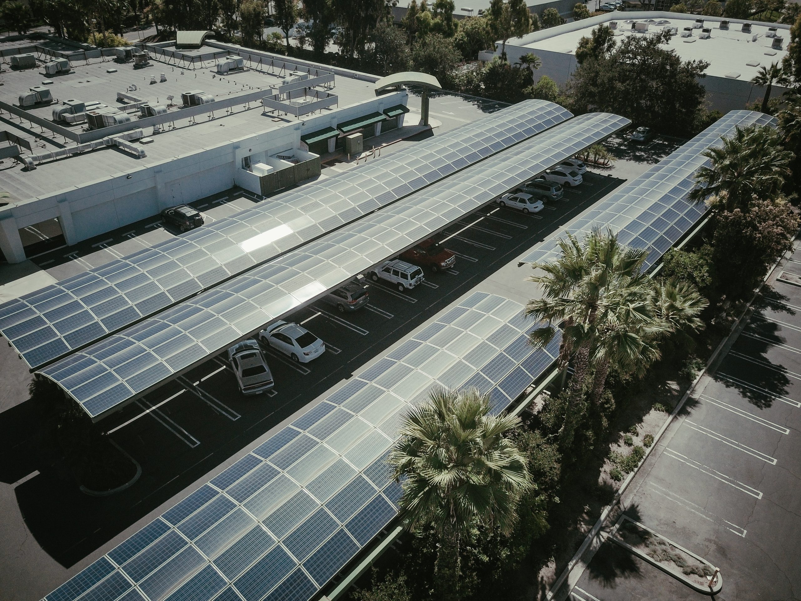 Industrial solar panels on a rooftop with blue sky background