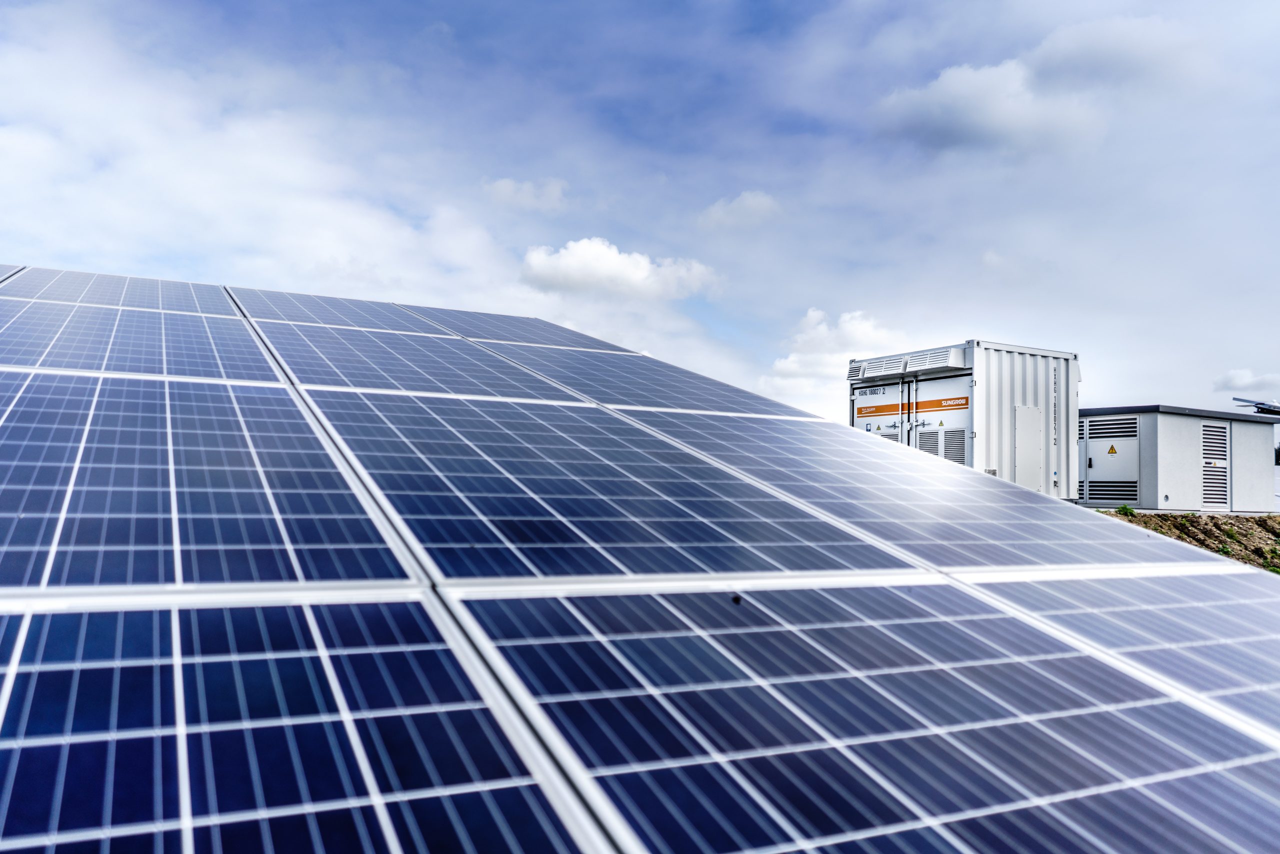 A commercial building with solar panels on its roof.