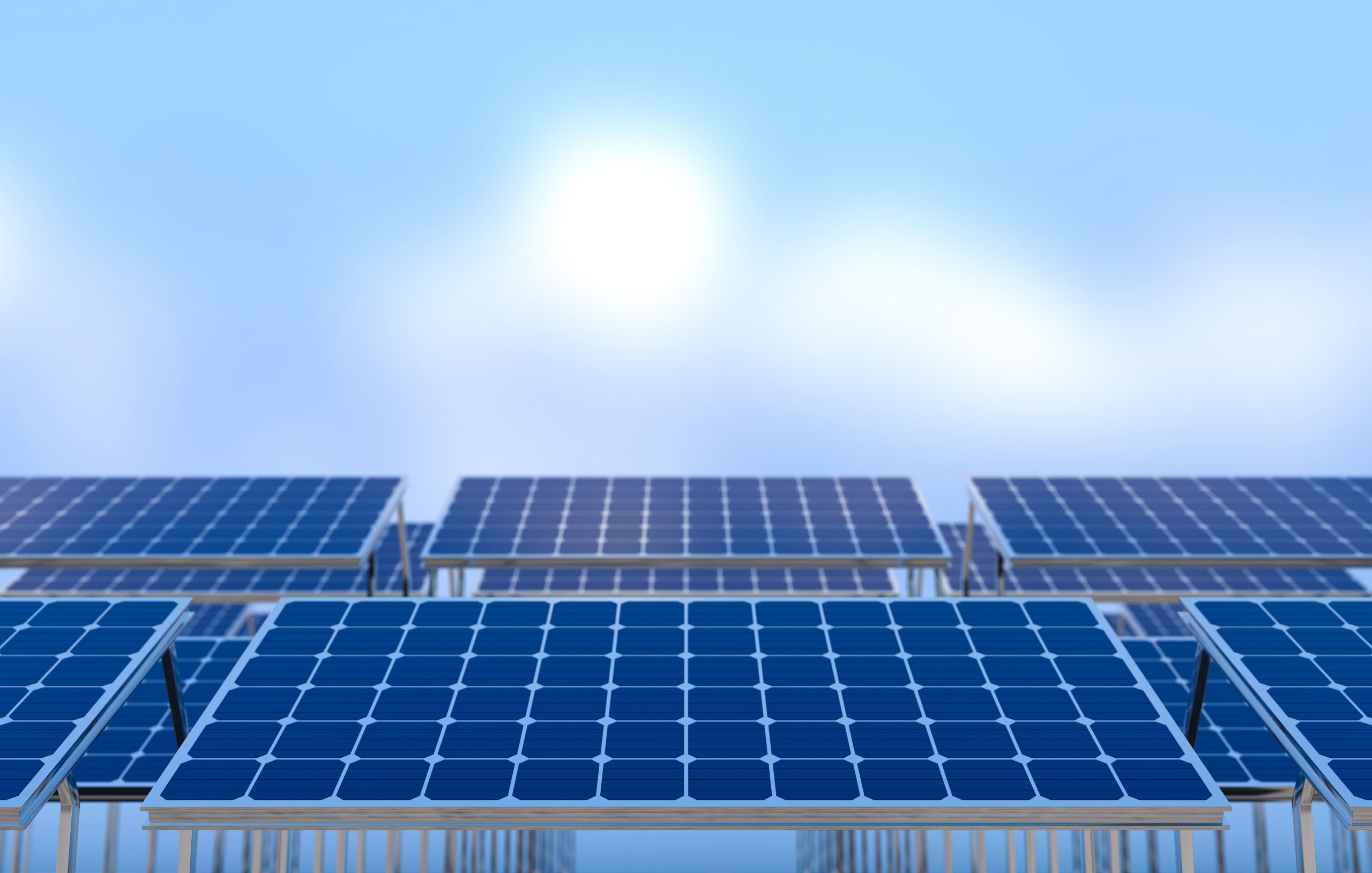 Solar panels on a rooftop with a blue sky background